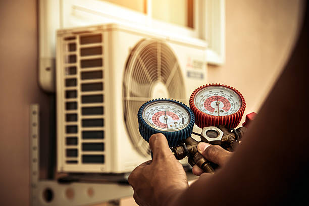 Professional Heat Pump Repair technician working in West Sayville, NY